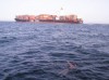 Rob swimming by freighter